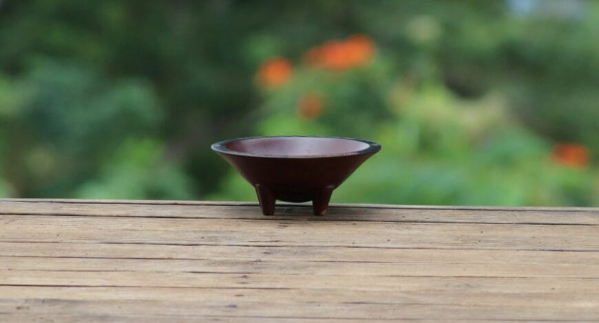 A small wooden kava bowl