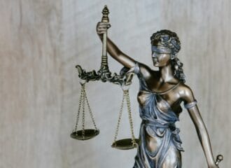 Bronze statue holding scales of justice