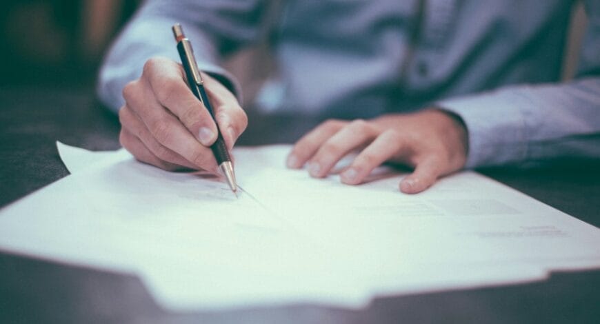 A man signing a legal document