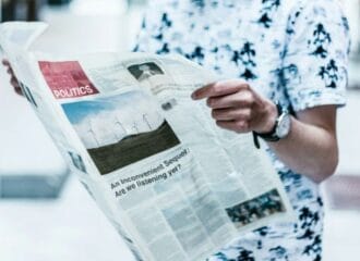 Person reading a newspaper